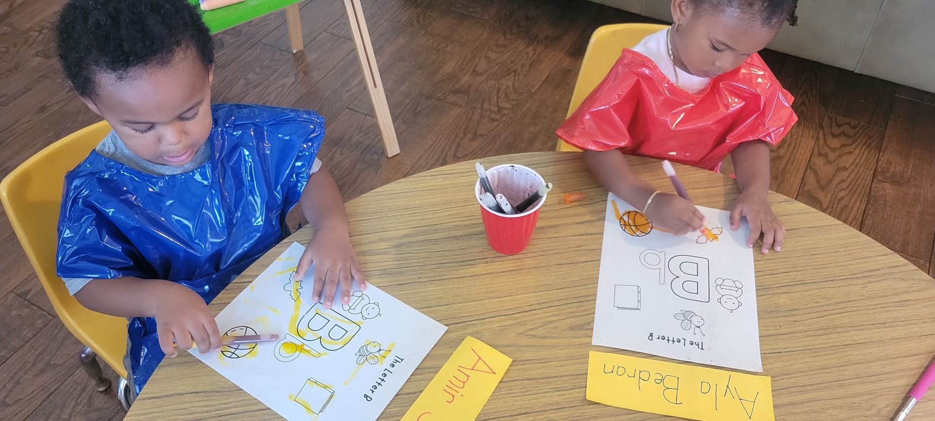 Children painting at Wise Leaders Academy